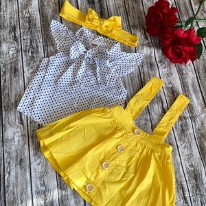 Little girls black polka dot shirt & yellow skirt